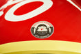 Load image into Gallery viewer, Heritage Racers F1 Icons crest decal detail on the red bodywork of a Heritage Racer D50