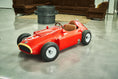 Load image into Gallery viewer, Heritage Racer D50 kids' electric ride-on F1 car — studio three-quarter front view in the atelier