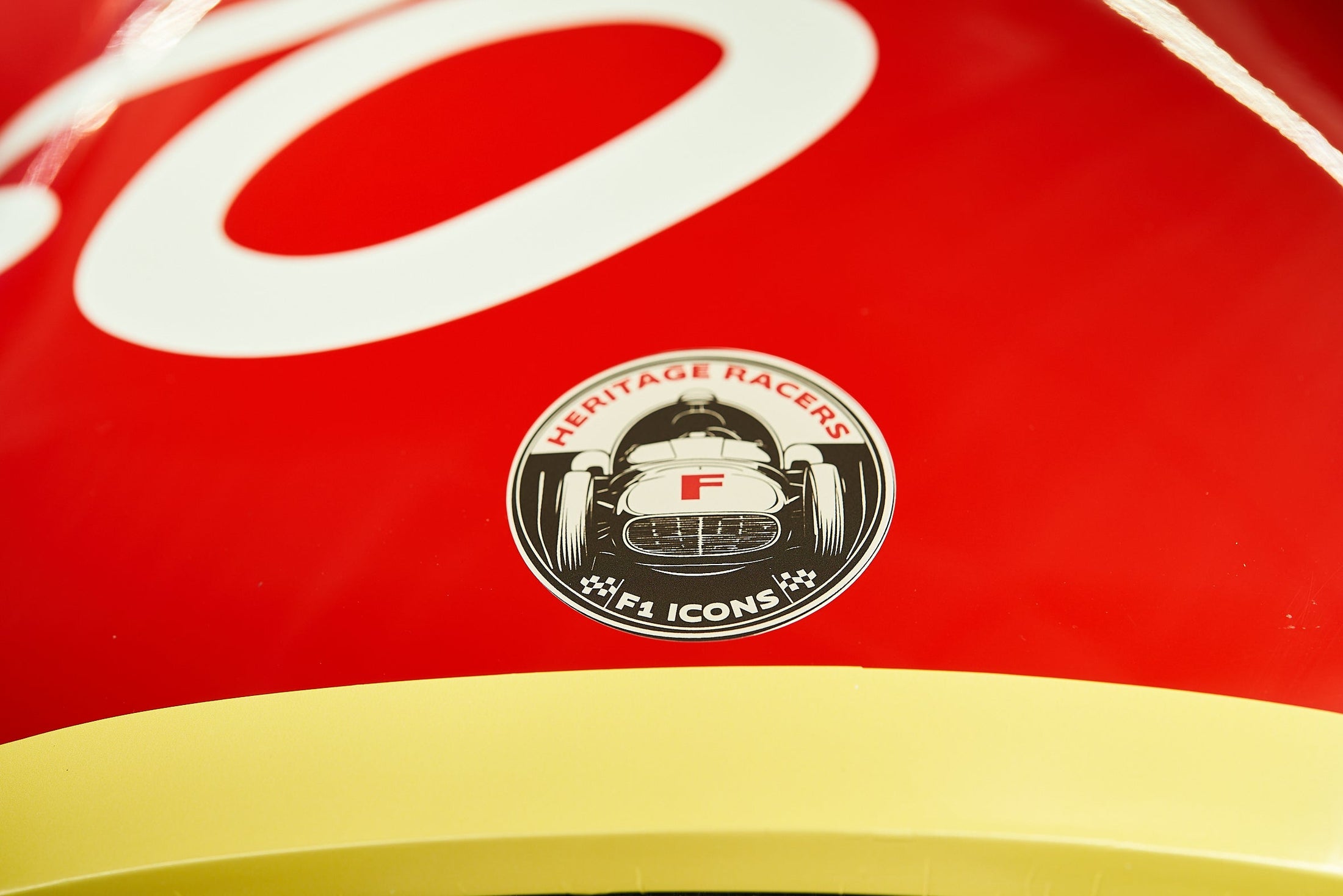 Heritage Racers F1 Icons crest decal detail on the red bodywork of a Heritage Racer D50